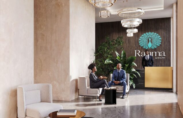Modern lobby with chandeliers and a reception desk