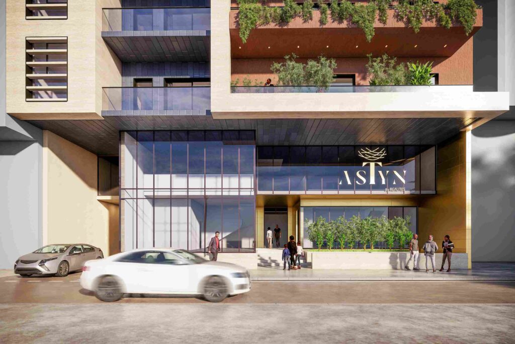 vue principale de la façade et des commerces au rez-de-chaussée de la résidence Astyn à Dakar